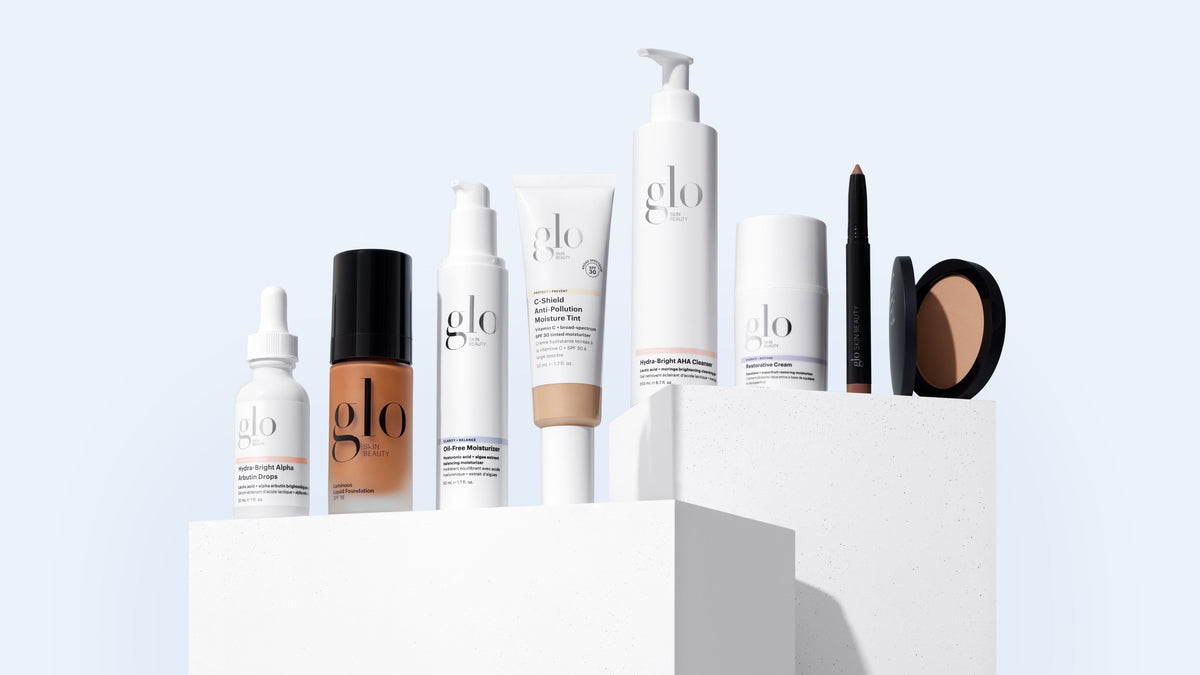 Glo Skin Beauty skincare and mineral makeup range arranged on white plinths against a pale blue background